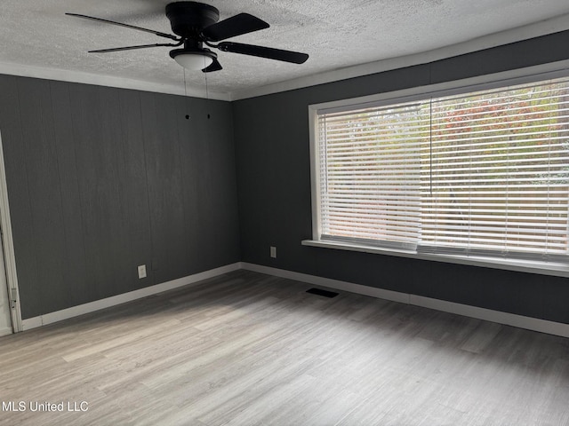 217 S Sunset Ter, Jackson, MS 39212 - empty room featuring a textured ceiling, light hardwood / wood-style flooring, and ceiling fan