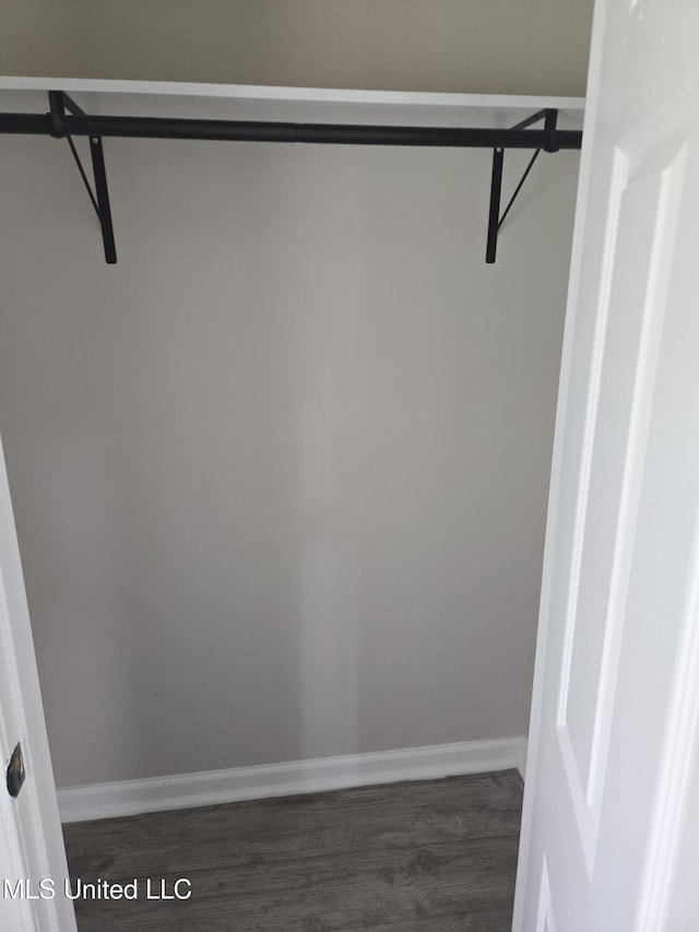783 Rising Star Rd, Holly Springs, MS 38635 - walk in closet featuring dark wood-style floors