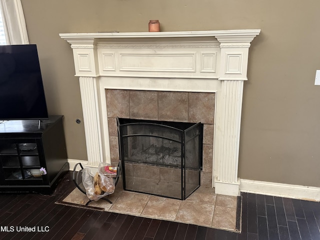 302 Chatfield Cv, Madison, MS 39110 - detailed view of wood finished floors, a tile fireplace, and baseboards