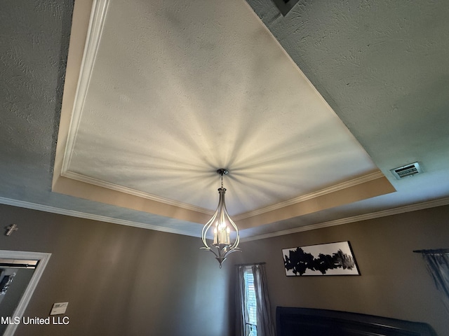 302 Chatfield Cv, Madison, MS 39110 - detailed view of a raised ceiling, crown molding, and a chandelier