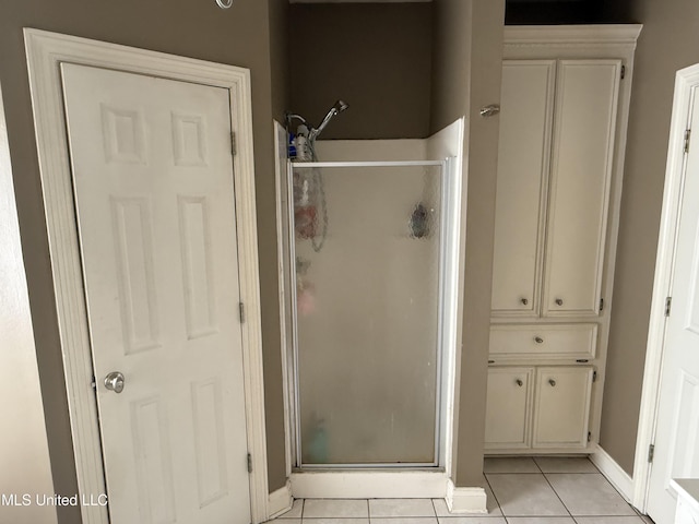 302 Chatfield Cv, Madison, MS 39110 - bathroom featuring a stall shower, tile patterned floors, and baseboards