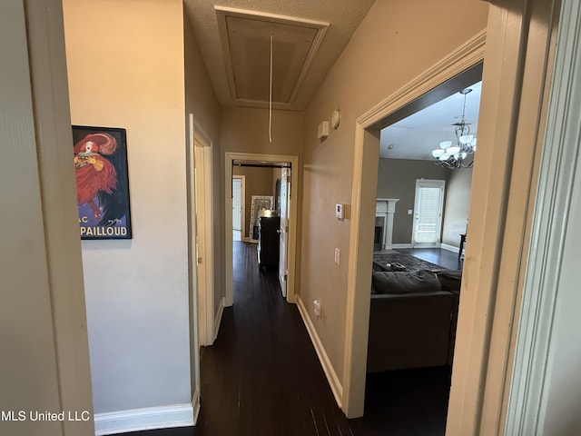 302 Chatfield Cv, Madison, MS 39110 - hall featuring attic access, dark wood-type flooring, and baseboards