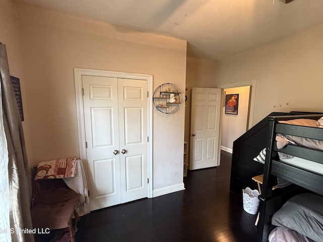 302 Chatfield Cv, Madison, MS 39110 - bedroom featuring dark wood-type flooring, a closet, and baseboards