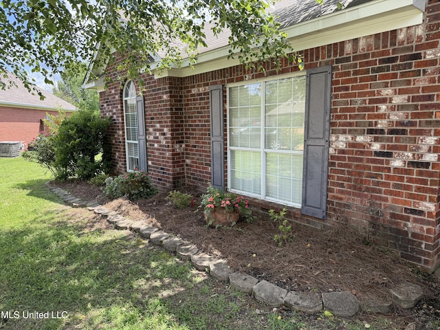 302 Chatfield Cv, Madison, MS 39110 - view of side of home featuring a yard and brick siding