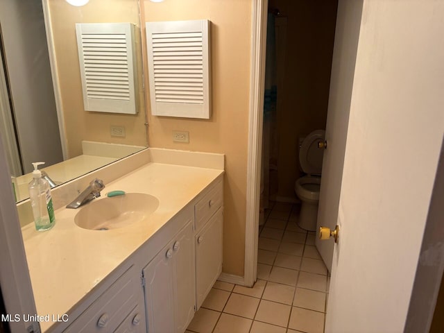 full bathroom with toilet, tile patterned flooring, vanity, and baseboards