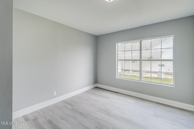 unfurnished room featuring light wood-type flooring