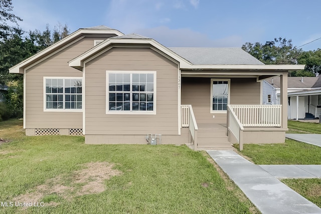 bungalow with a porch and a front lawn