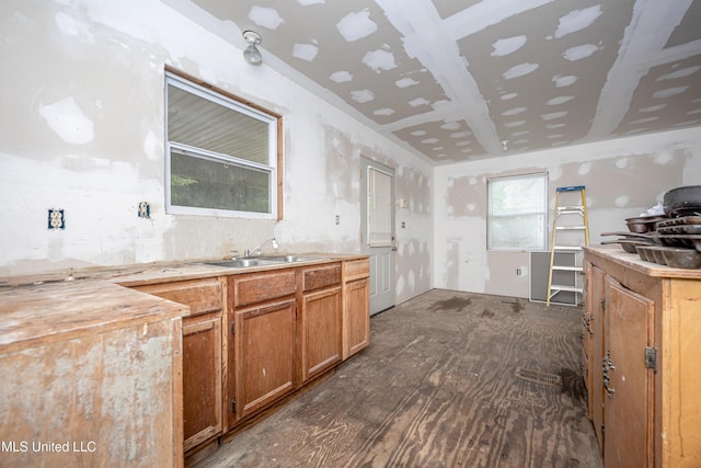 134 Lynne Ln, Lucedale, MS 39452 - kitchen with a sink, brown cabinetry, and light countertops