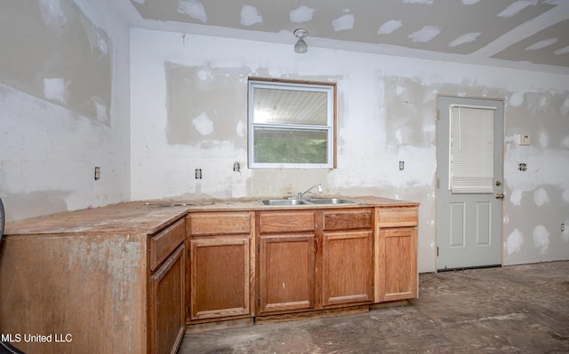 134 Lynne Ln, Lucedale, MS 39452 - kitchen featuring a sink, brown cabinetry, and light countertops