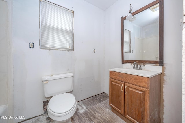 134 Lynne Ln, Lucedale, MS 39452 - bathroom featuring toilet, vanity, and wood finished floors