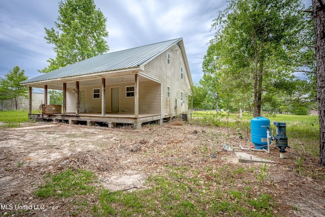134 Lynne Ln, Lucedale, MS 39452 - view of property exterior featuring metal roof and covered porch