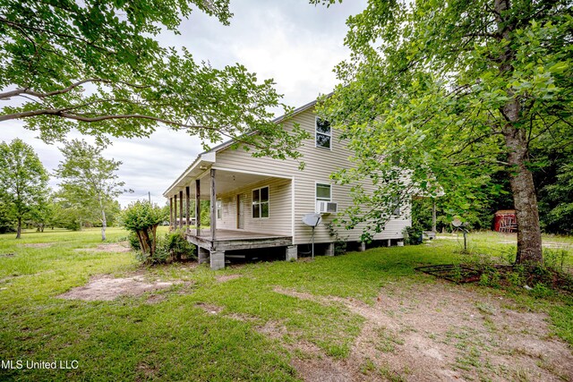 134 Lynne Ln, Lucedale, MS 39452 - back of property with a yard and cooling unit