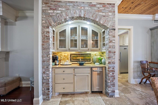 bar featuring tasteful backsplash, stainless steel refrigerator, ornamental molding, and wooden ceiling