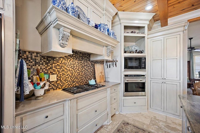 kitchen featuring tasteful backsplash, appliances with stainless steel finishes, and wooden ceiling