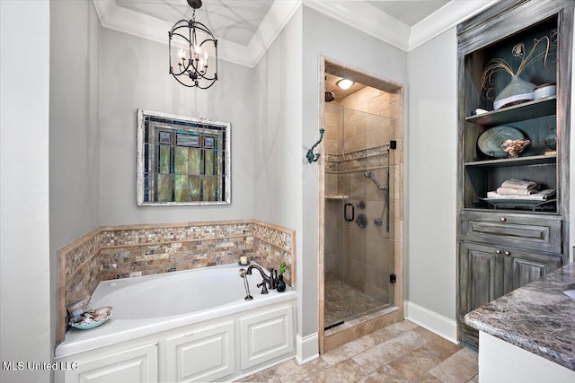 bathroom featuring vanity, independent shower and bath, ornamental molding, and an inviting chandelier