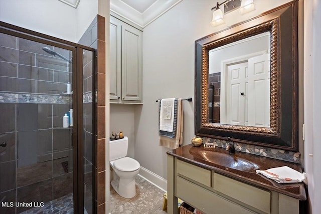 bathroom featuring vanity, toilet, crown molding, and a shower with door