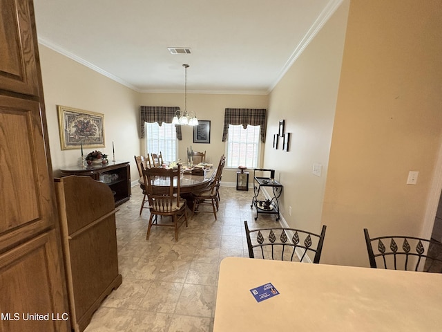 dining space with a chandelier, baseboards, visible vents, and crown molding