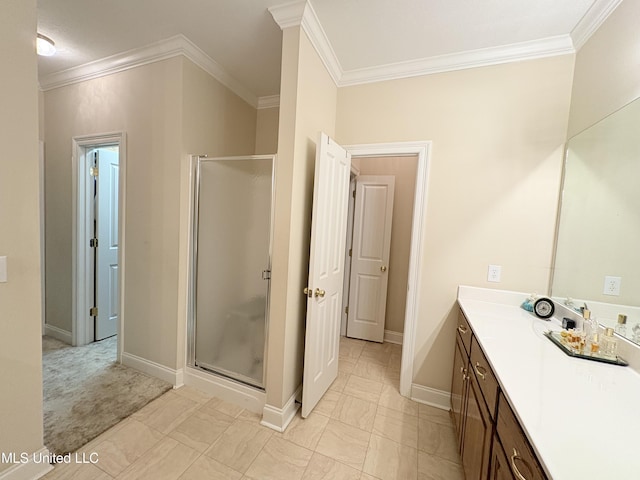 bathroom featuring a stall shower, baseboards, crown molding, and vanity