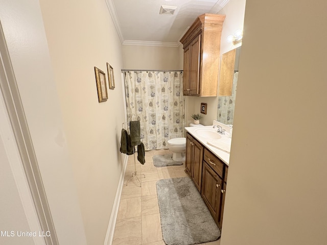 bathroom featuring toilet, ornamental molding, vanity, and visible vents