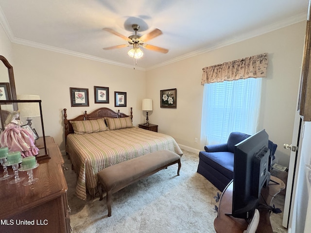 bedroom featuring ornamental molding, carpet flooring, baseboards, and a ceiling fan