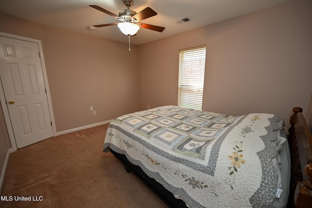 bedroom with light colored carpet, baseboards, ceiling fan, and visible vents