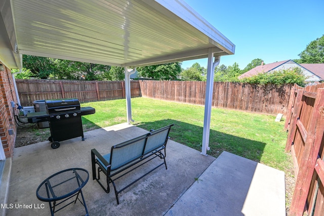 view of patio / terrace featuring a fenced backyard and a grill