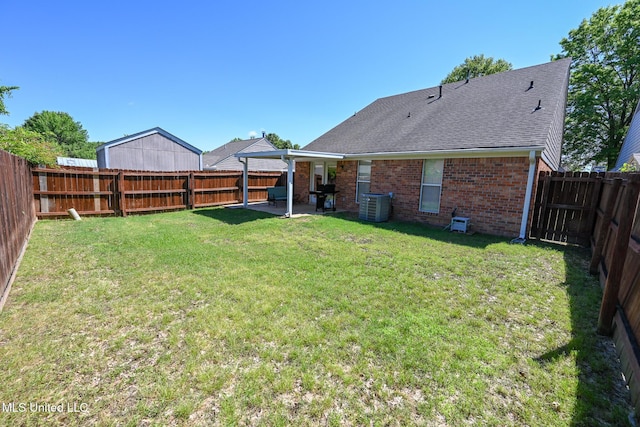 view of yard featuring a fenced backyard, a patio, and cooling unit
