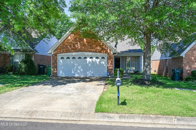 view of front of home featuring a front yard, brick siding, an attached garage, and driveway
