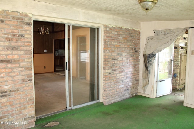 7000 Melrose Dr, Biloxi, MS 39532 - carpeted spare room featuring brick wall