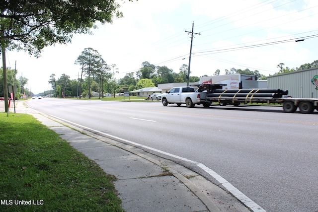 7000 Melrose Dr, Biloxi, MS 39532 - view of asphalt street with sidewalks and curbs