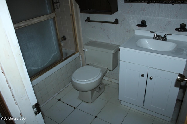 7000 Melrose Dr, Biloxi, MS 39532 - bathroom featuring toilet, vanity, tiled shower / bath combo, and tile patterned flooring