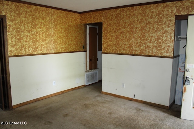 7000 Melrose Dr, Biloxi, MS 39532 - spare room featuring wallpapered walls, carpet floors, a wainscoted wall, ornamental molding, and baseboards
