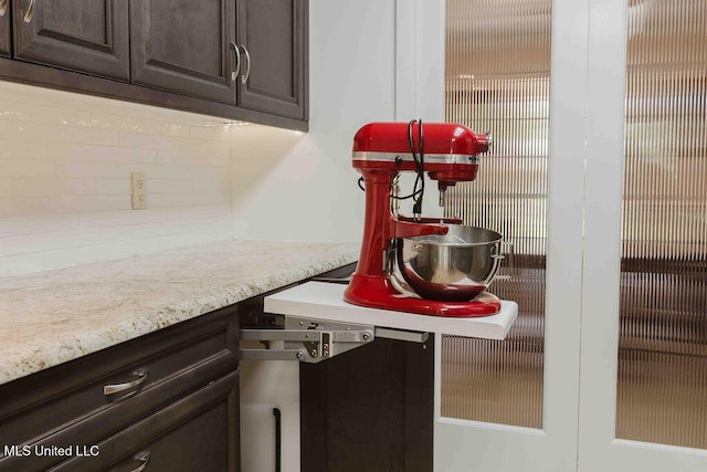 interior space featuring dark brown cabinetry and tasteful backsplash