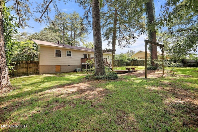 2709 Burma Dr, Pearl, MS 39208 - fenced backyard featuring a deck