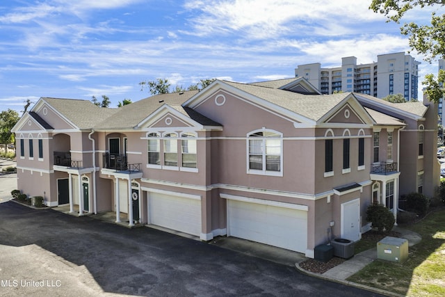 townhome / multi-family property featuring central AC unit