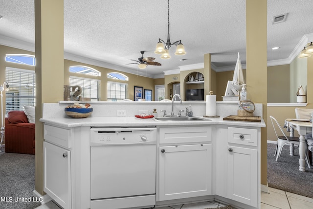 kitchen with white cabinetry, sink, white dishwasher, light colored carpet, and ceiling fan with notable chandelier