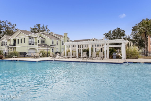 view of pool featuring a pergola, grilling area, and a patio area