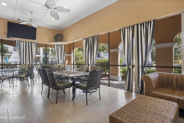 dining area with ceiling fan and coffered ceiling