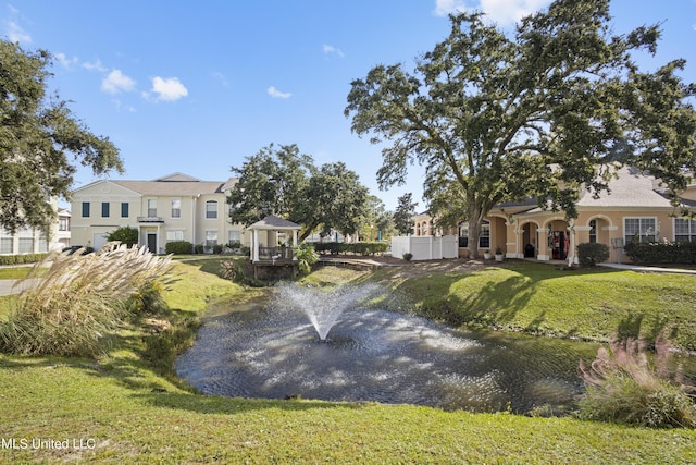 exterior space with a gazebo and a yard