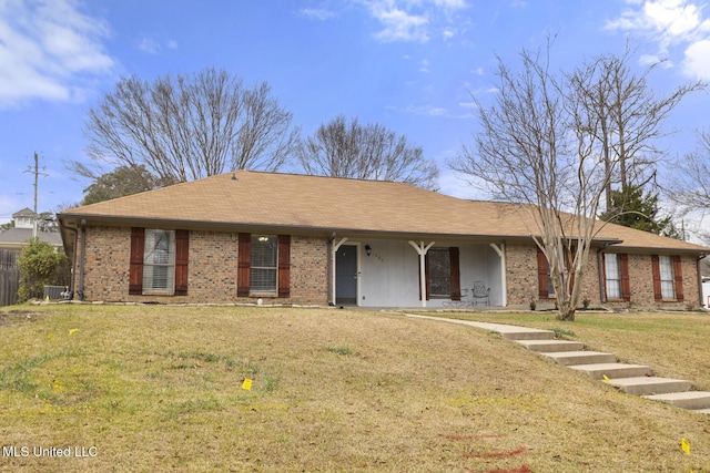 ranch-style home featuring a front yard