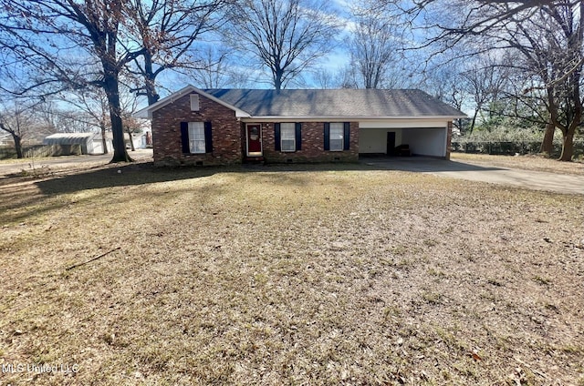 single story home featuring a carport