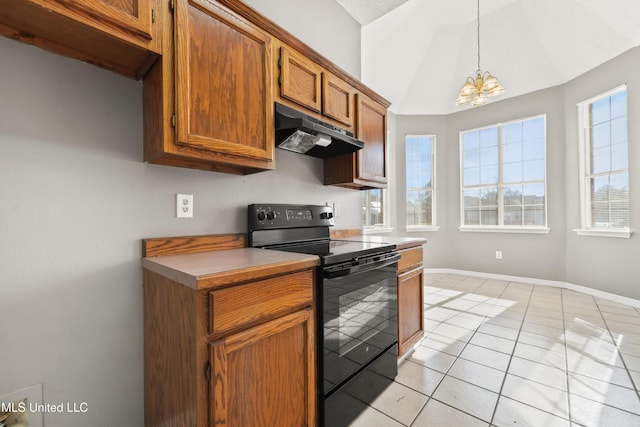 kitchen featuring under cabinet range hood, vaulted ceiling, brown cabinets, an inviting chandelier, and black electric range