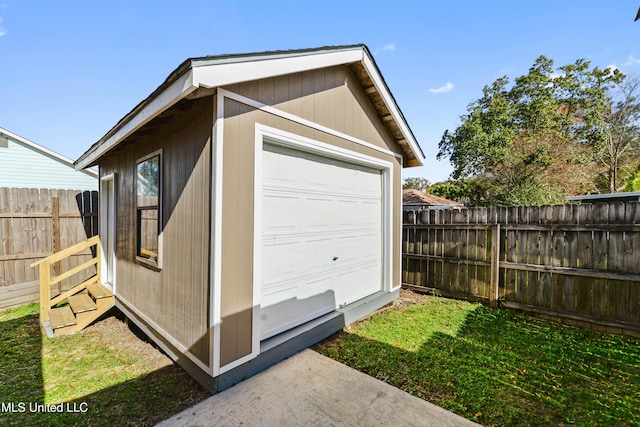 view of outdoor structure with an outbuilding and fence