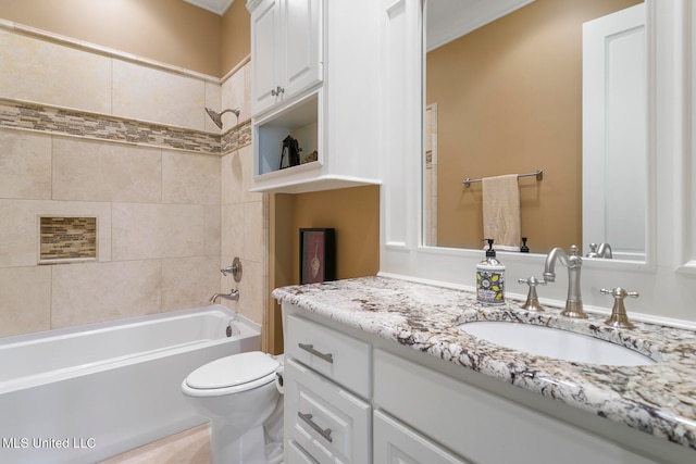 full bathroom with vanity, toilet, and tiled shower / bath combo