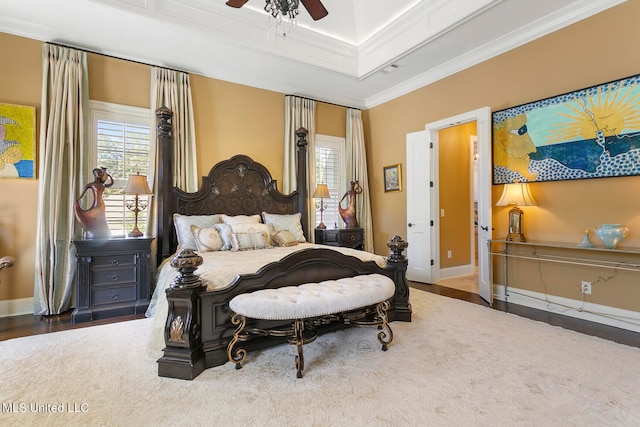 bedroom featuring ornamental molding, hardwood / wood-style flooring, and ceiling fan