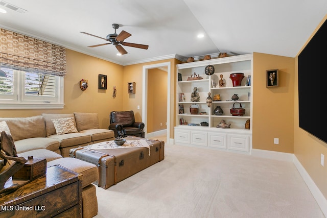 living room with light carpet, ornamental molding, ceiling fan, and vaulted ceiling