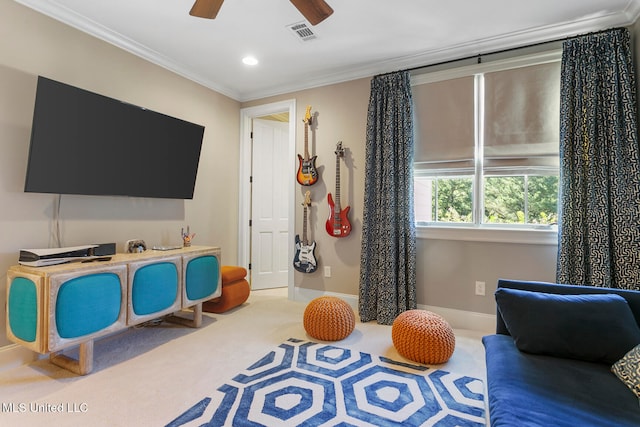 rec room with carpet, ornamental molding, and ceiling fan