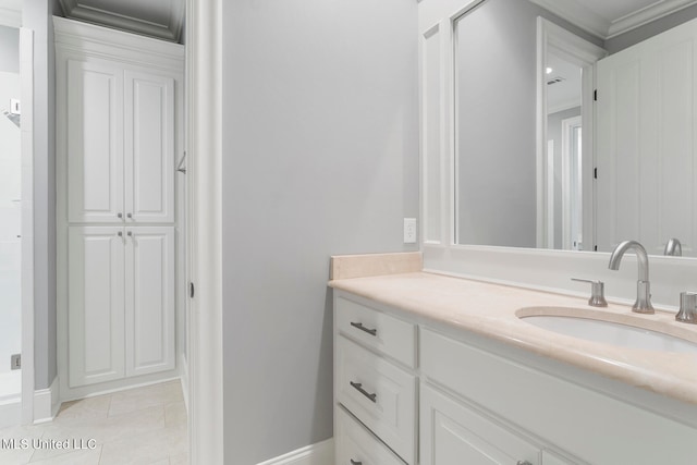 bathroom featuring vanity, ornamental molding, and tile patterned floors