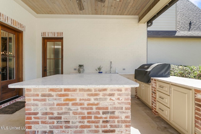 view of patio featuring sink and a grill