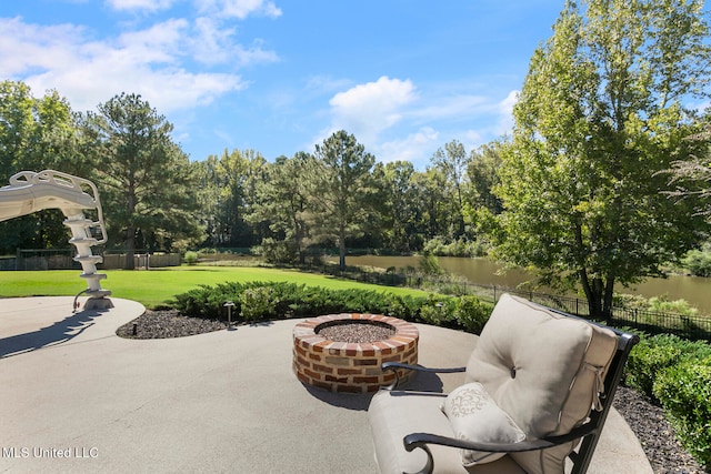 view of patio / terrace featuring an outdoor fire pit